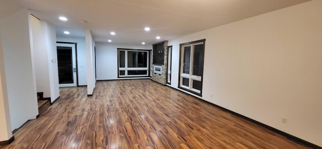 empty room with dark wood-type flooring