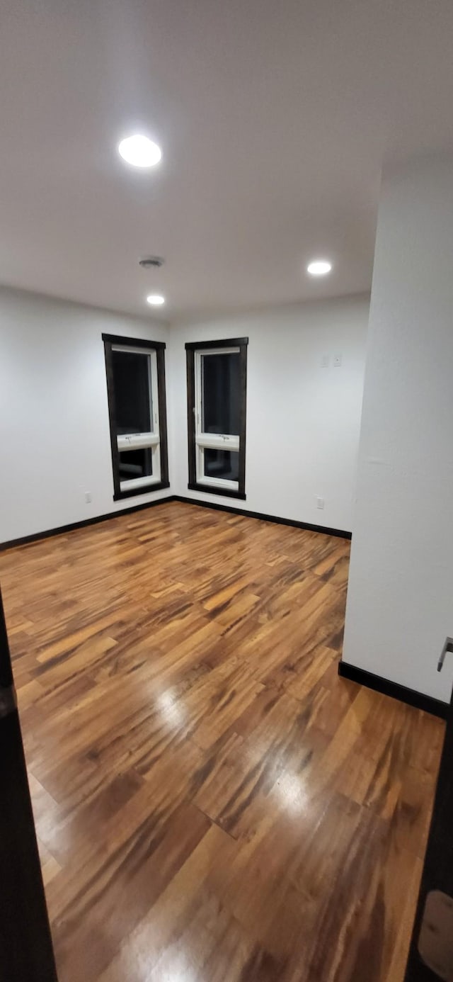 empty room featuring wood-type flooring