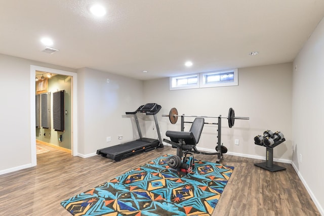 workout room with hardwood / wood-style floors