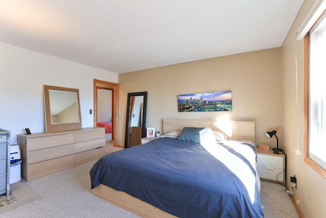 bedroom featuring light carpet