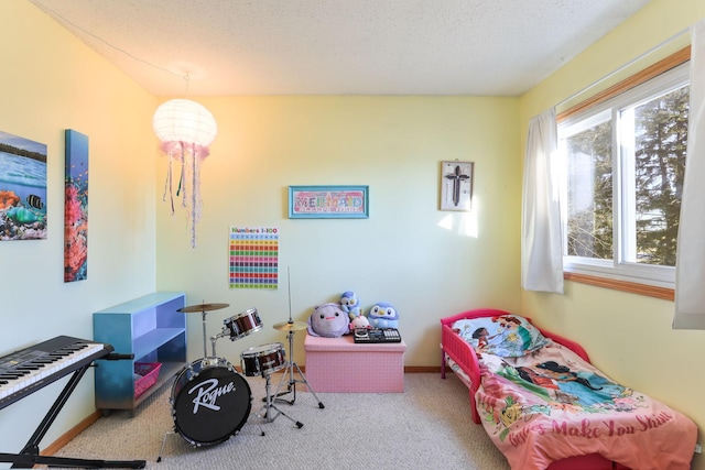 carpeted bedroom featuring a textured ceiling