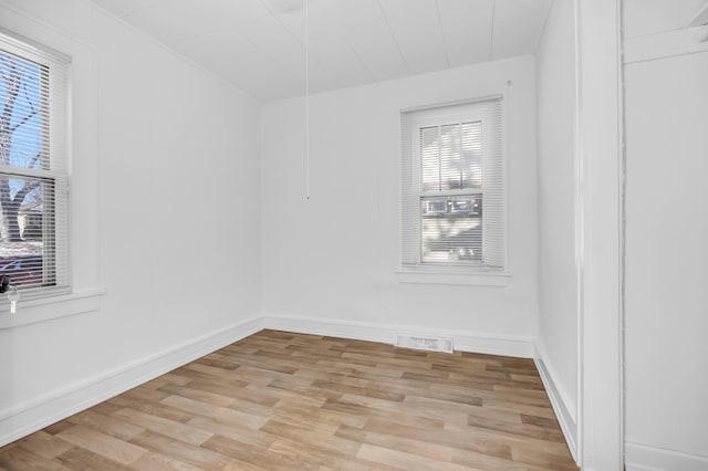 unfurnished room with light hardwood / wood-style floors