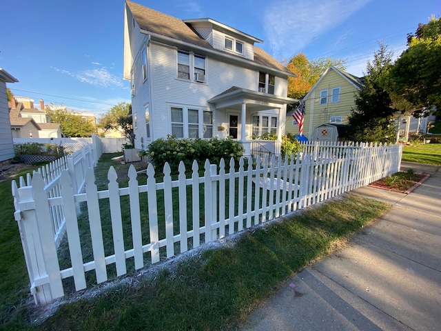 view of front of house featuring a porch and central air condition unit