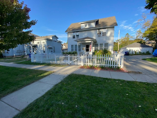 traditional style home featuring a fenced front yard and a front yard