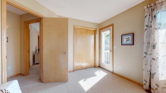 entryway with light colored carpet