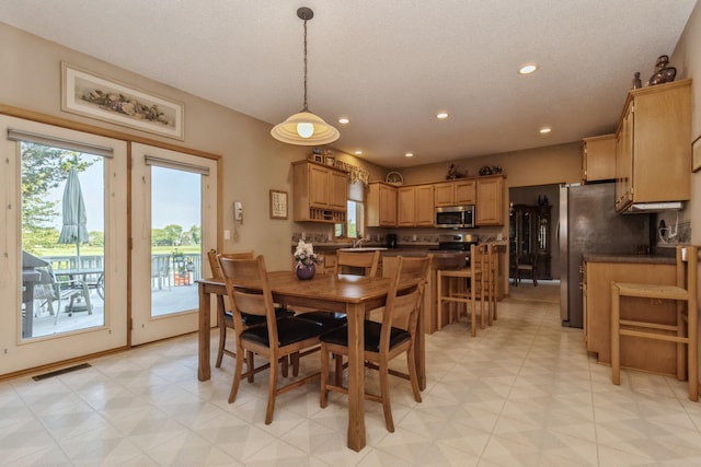 dining room with recessed lighting and visible vents