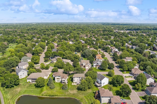 drone / aerial view with a residential view and a water view