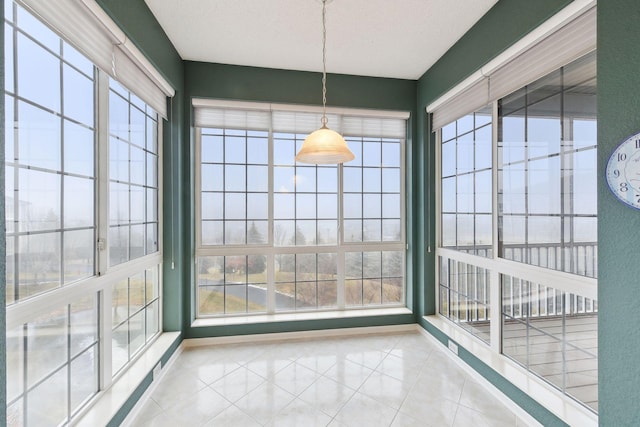 unfurnished dining area with light tile patterned floors