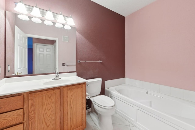 bathroom with tile patterned flooring, vanity, a bath, and toilet