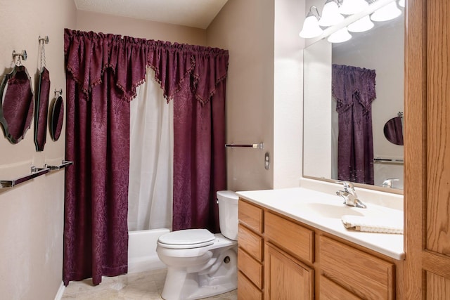 full bathroom featuring shower / bath combo, vanity, and toilet