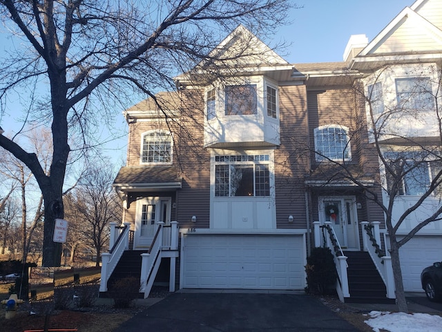 multi unit property featuring a garage