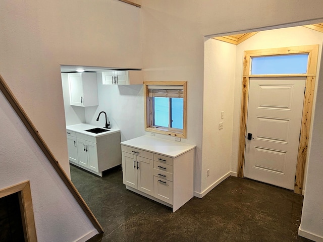 kitchen featuring sink and white cabinetry