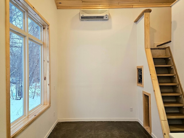 interior space featuring dark colored carpet and a wall unit AC