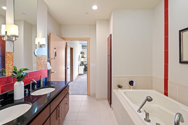 bathroom featuring vanity, backsplash, tile patterned floors, and tiled bath