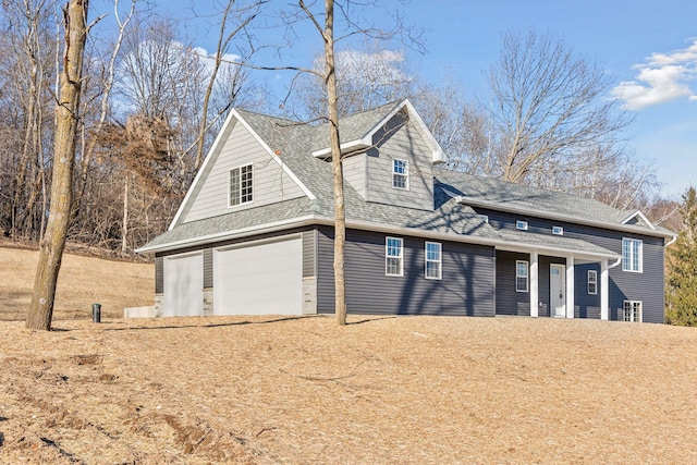 view of side of property featuring a garage