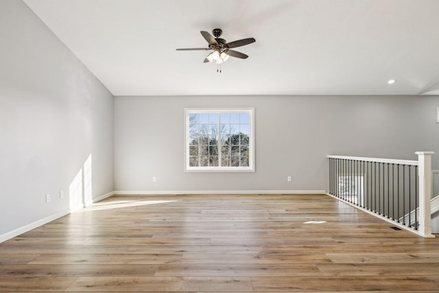 spare room featuring ceiling fan and light hardwood / wood-style flooring