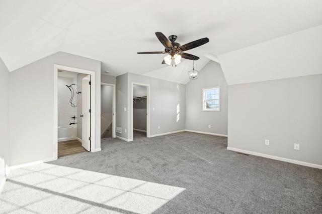 bonus room with carpet flooring, ceiling fan, and lofted ceiling