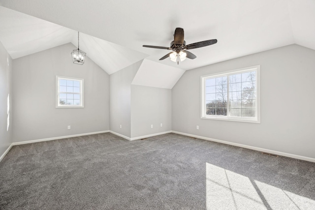 additional living space featuring a healthy amount of sunlight and vaulted ceiling