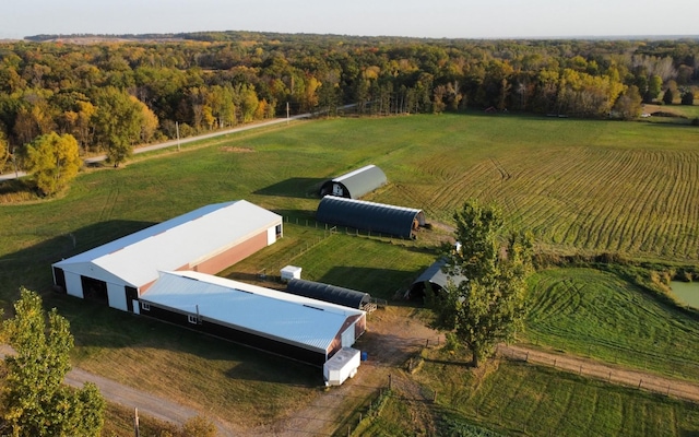 birds eye view of property featuring a rural view and a forest view