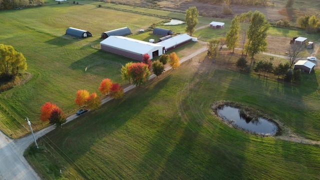 aerial view with a rural view and a water view