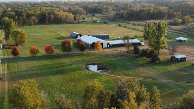 birds eye view of property with a rural view