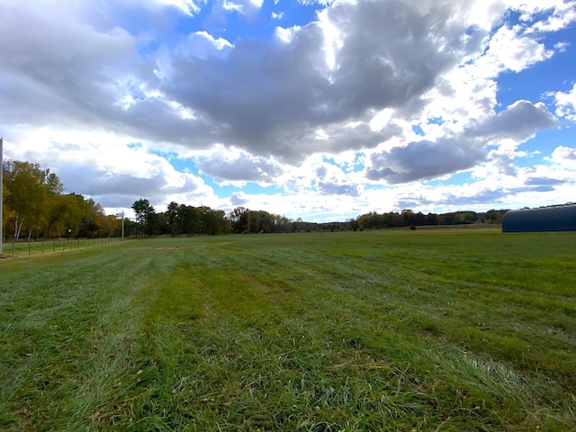 view of yard with a rural view