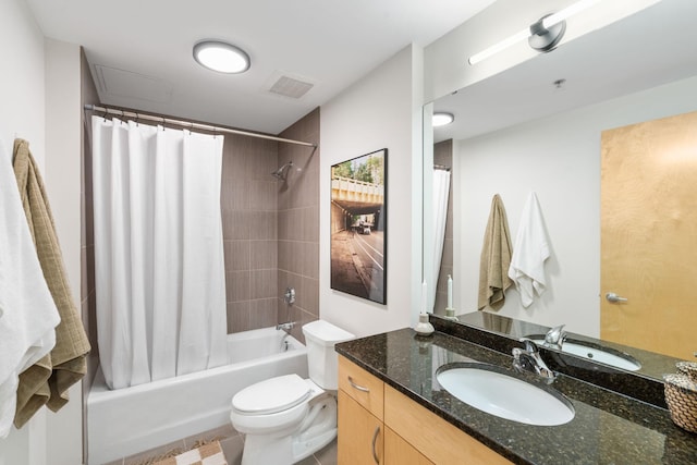 full bathroom with tile patterned flooring, vanity, shower / bath combo, and toilet