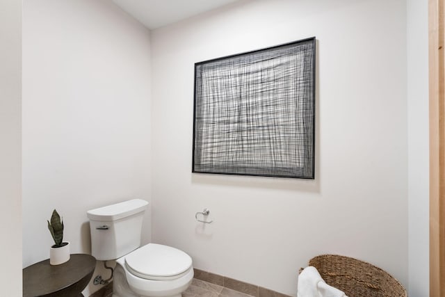 bathroom featuring tile patterned flooring and toilet