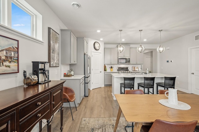 dining space featuring light wood-type flooring