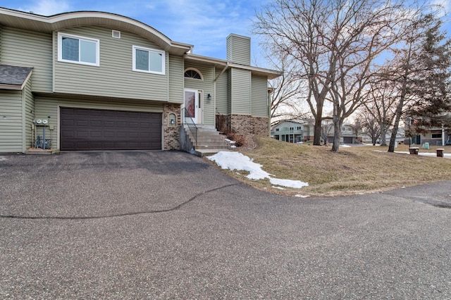 view of front of home with a garage