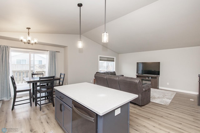 kitchen featuring pendant lighting, light wood-type flooring, an inviting chandelier, and a kitchen island