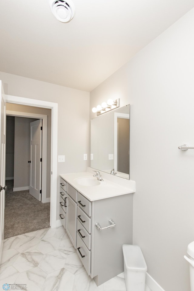 bathroom with vanity and toilet