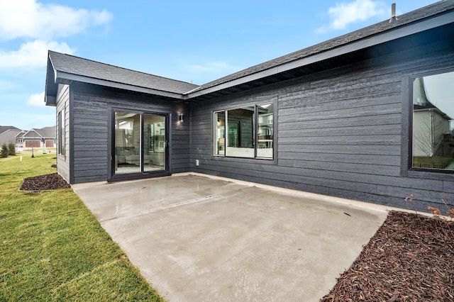 exterior space with a lawn and a patio area