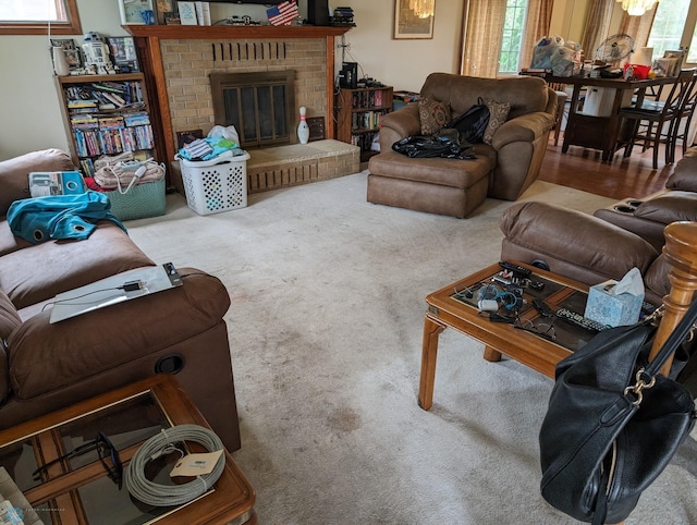 carpeted living room featuring a fireplace