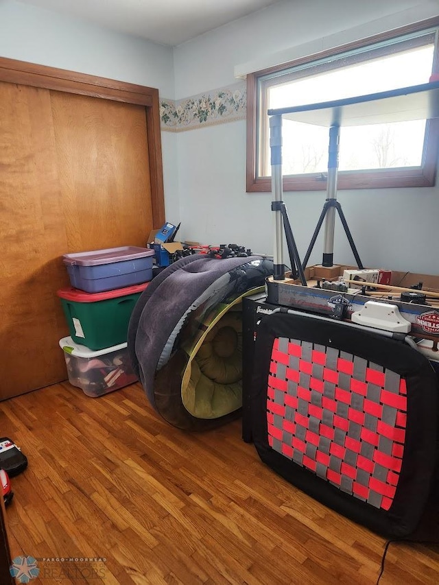 bedroom with hardwood / wood-style floors