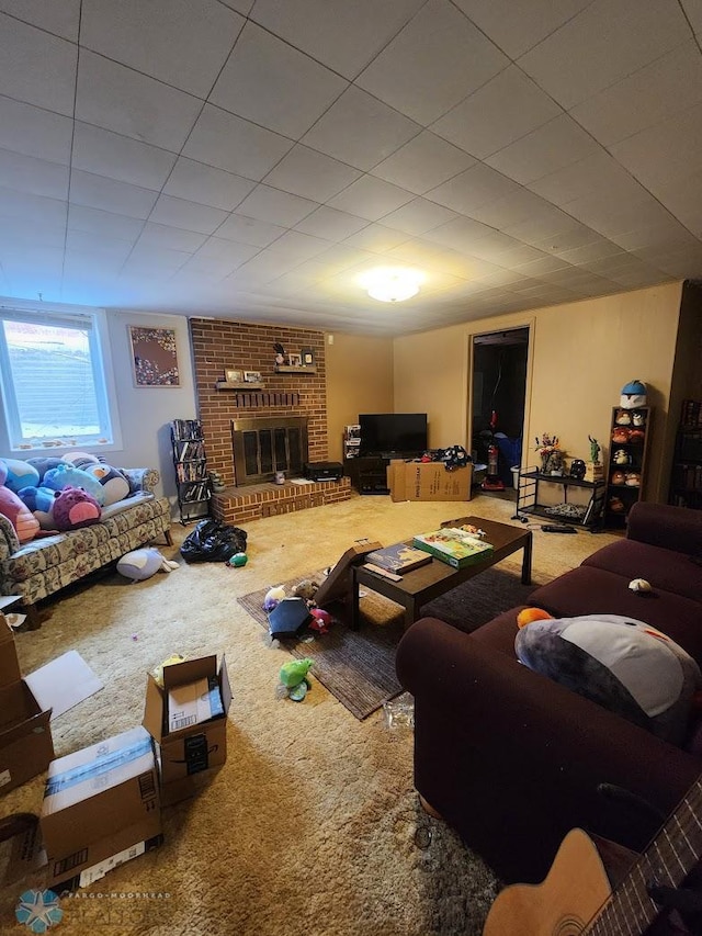 living room featuring carpet floors and a brick fireplace