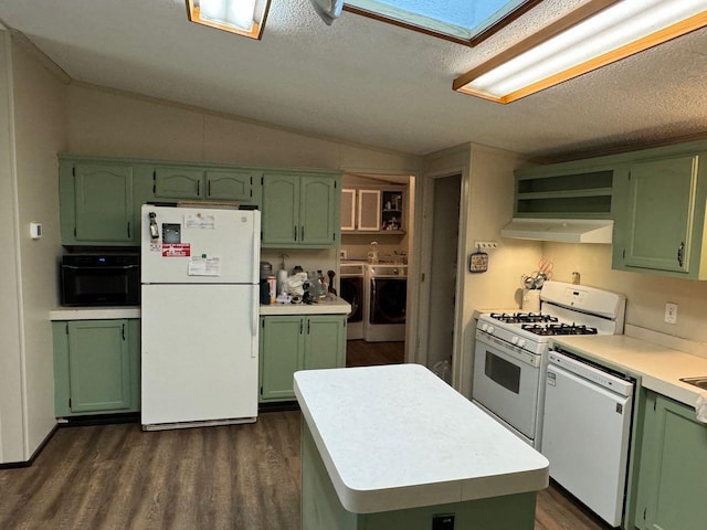 66156 County Road 132, Northome, MN 56661 - kitchen featuring vaulted ceiling with skylight, green cabinets, white appliances, and washing machine and clothes dryer