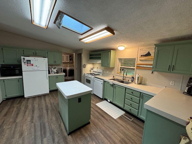 66156 County Road 132, Northome, MN 56661 - kitchen featuring sink, green cabinets, white appliances, vaulted ceiling with skylight, and a kitchen island