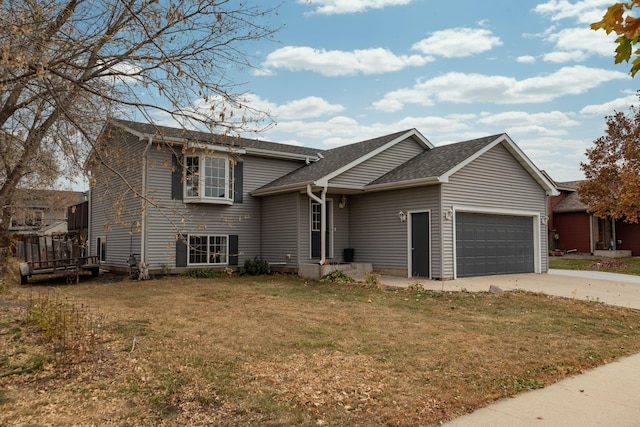 view of front of property with a garage and a front lawn