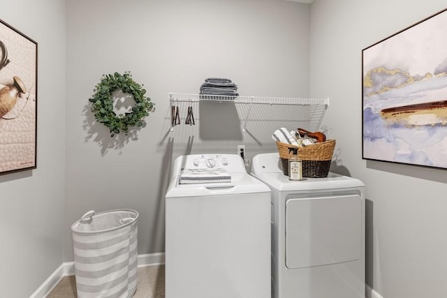 laundry area with washing machine and clothes dryer