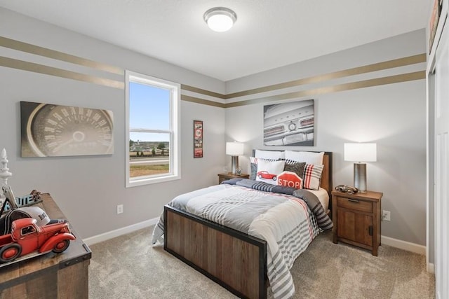 bedroom featuring light colored carpet