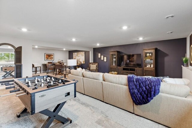 game room with light colored carpet