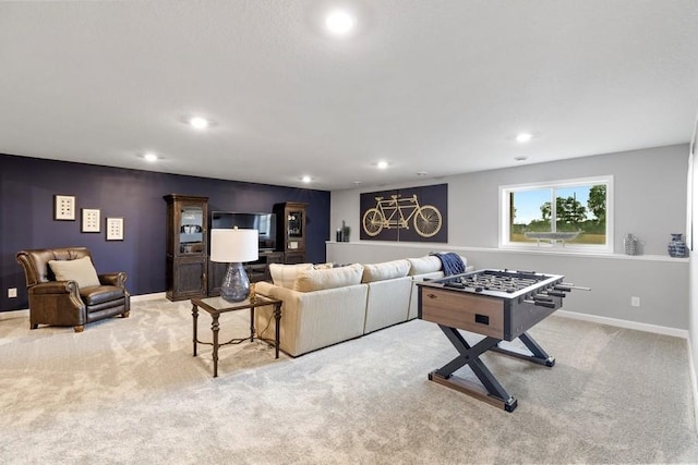 recreation room with light colored carpet