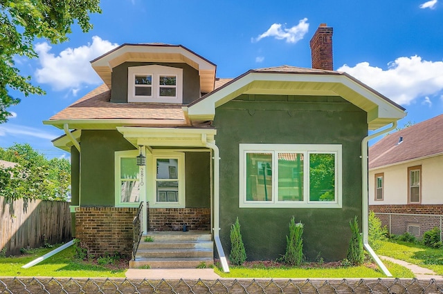 2810 Penn Ave N, Minneapolis, MN 55411 - view of front of house with stucco siding and a chimney