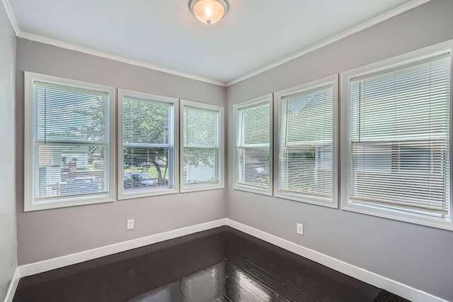 2810 Penn Ave N, Minneapolis, MN 55411 - spare room featuring crown molding and dark wood-style floors