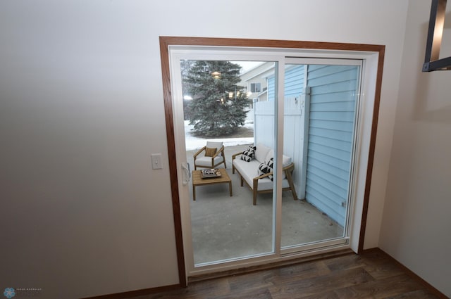 doorway to outside with dark hardwood / wood-style flooring