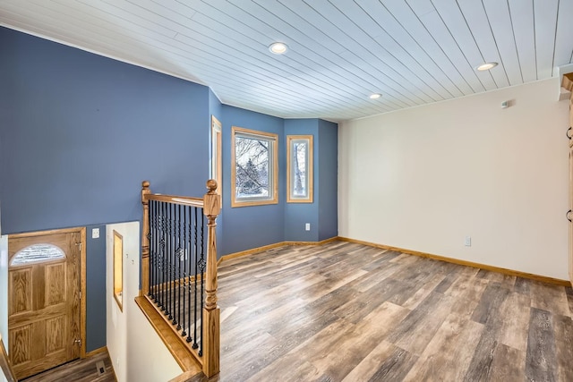 interior space featuring hardwood / wood-style floors and wooden ceiling