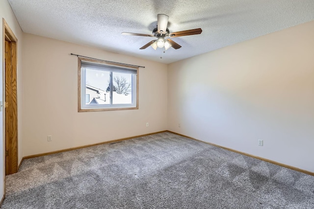 empty room featuring a textured ceiling, ceiling fan, and carpet flooring