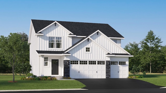 view of front facade with a garage and a front yard