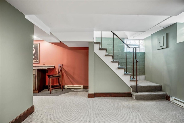 stairs featuring a bar, baseboard heating, and carpet